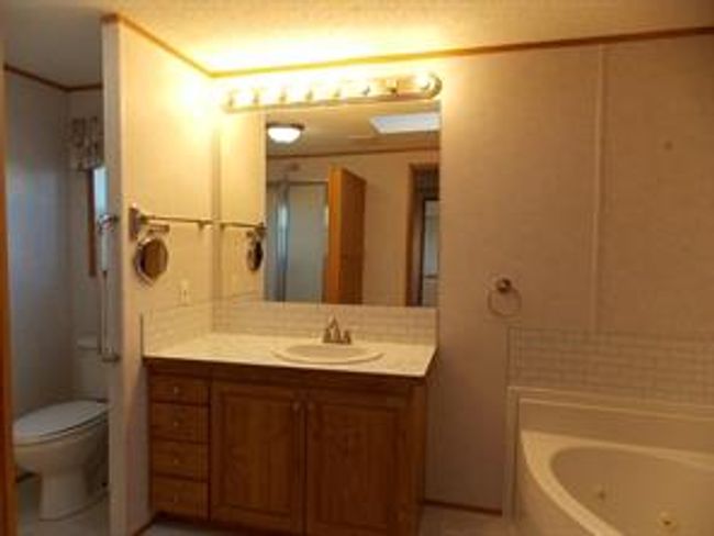 77 - 5210 65 Ave, Home with 3 bedrooms, 2 bathrooms and 3 parking in Olds AB | Image 22