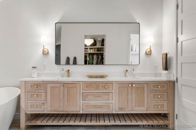 Primary bath with heated floors, dual vanity, separate makeup vanity, and luxury walk-in steam shower with heated floors | Image 47