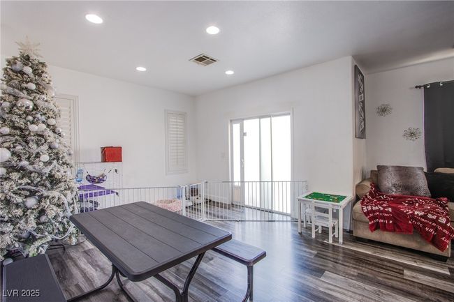 Dining room featuring wood finished floors and recessed lighting | Image 7