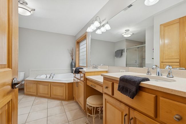 Upper Level Primary Bathroom Double Bowl Vanity and Corner Jetted Tub | Image 26