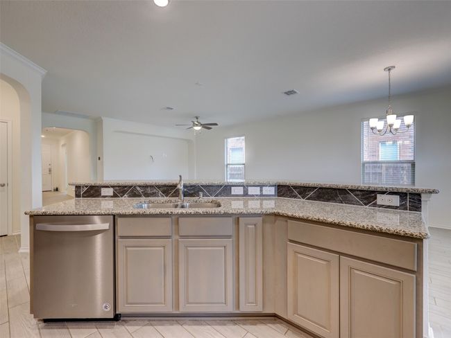 Kitchen opens to living and dining | Image 10