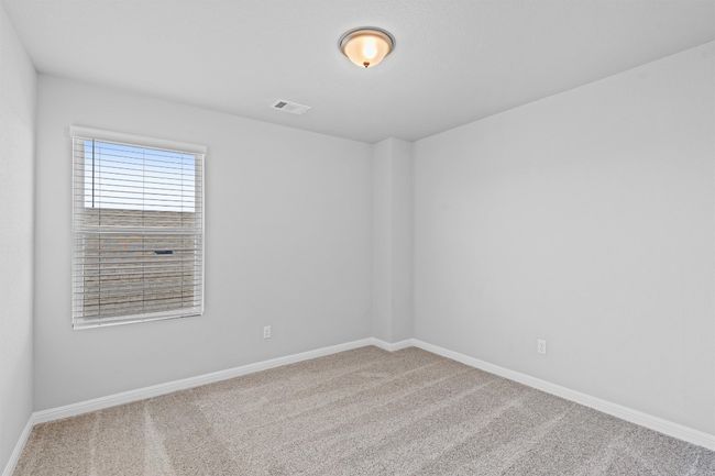 Carpeted empty room featuring baseboards | Image 25