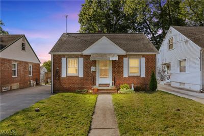 Bungalow-style house with a yard | Image 1