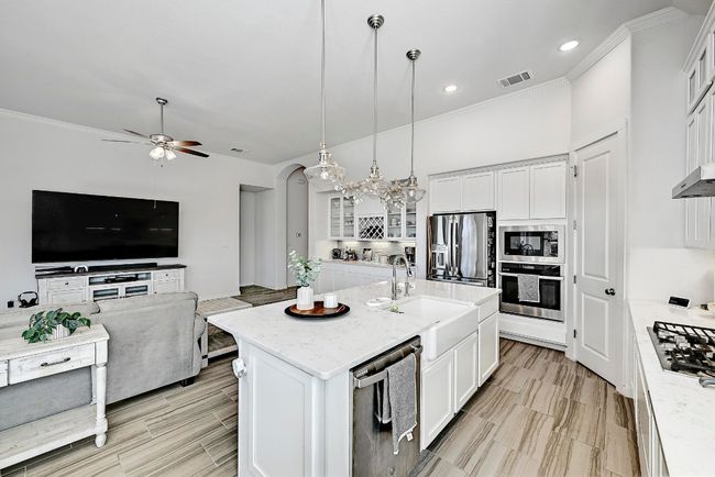 The kitchen is designed with entertaining in mind, offering easy flow into the spacious great room for effortless hosting. | Image 10