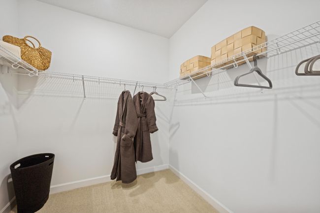 Photo is of the actual model. The primary bedroom features a wonderful walk-in closet. | Image 13