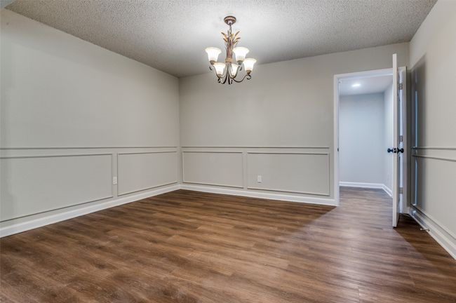 Dining room leading into the utility room. | Image 15