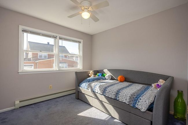 Bedroom with ceiling fan, carpet and baseboard | Image 15