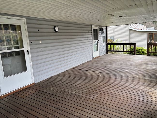 Massive Covered Deck Over Looking the Pool and backyard | Image 6