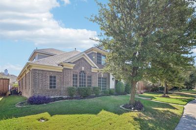 View of front of home featuring a front yard and cooling unit | Image 3