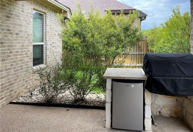View of patio featuring grilling area | Image 22