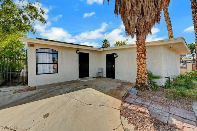 View of front facade with stucco siding and a patio area | Image 5