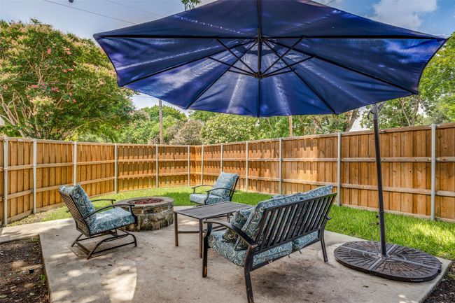 Patio off living area; has a fire pit with automatic gas | Image 20