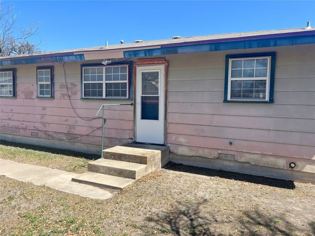 View of exterior entry with crawl space | Image 13