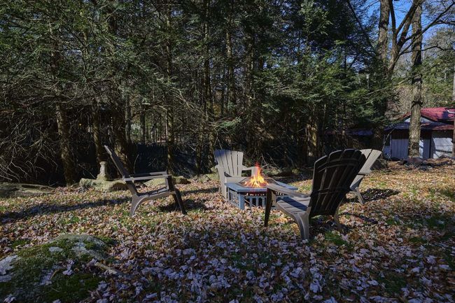 View of yard featuring a fire pit | Image 13