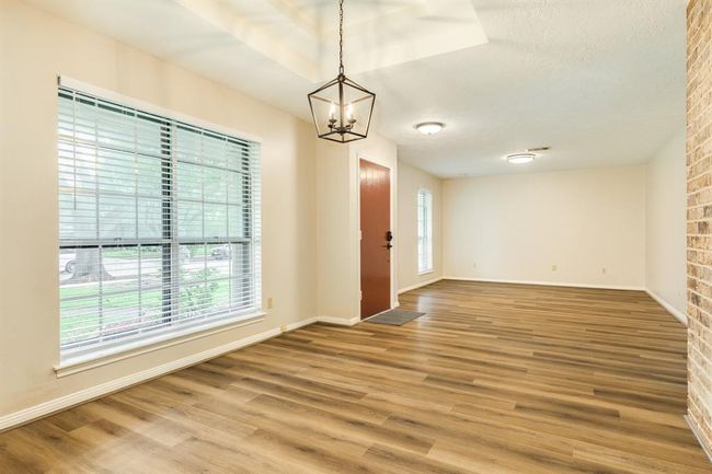 At the front of the home sits the formal living & dining room -- plenty of space to entertain family & friends. LVP throughout the living spaces of the home. | Image 8