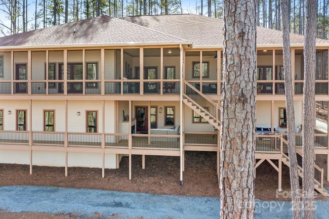 Two stories of decking for entertainng. Upper level is screened in and lower level is open. | Image 6