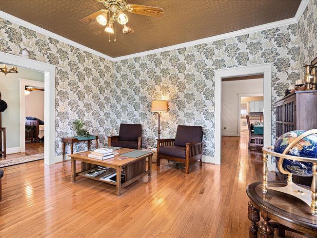 General seating and reading area is a marvel of decorative styling, and welcomes you to the area. | Image 9