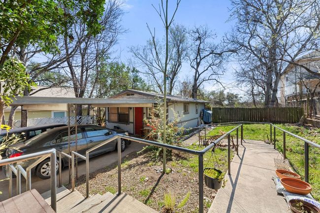 View of front of property featuring a carport and fence | Image 26