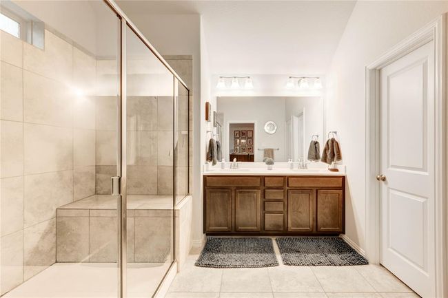Primary bathroom with two sinks and large walk-in shower | Image 26
