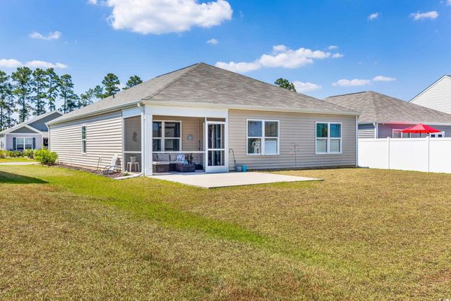 Rear view of property with a patio and a shingled roof | Image 34