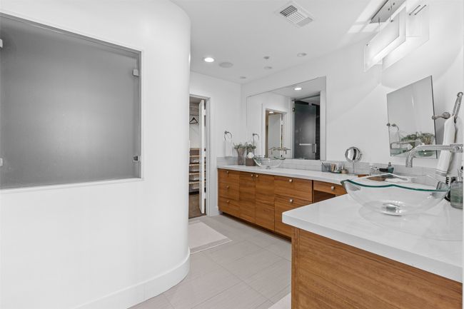 Bathroom featuring recessed lighting, tile patterned floors, double vanity, visible vents, and a sink | Image 19