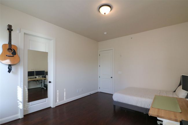 Unfurnished bedroom with wood finished floors and baseboards | Image 23