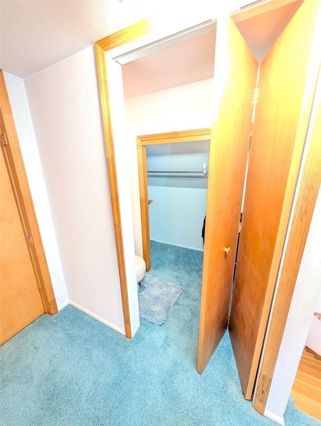 Corridor featuring light carpet | Image 17