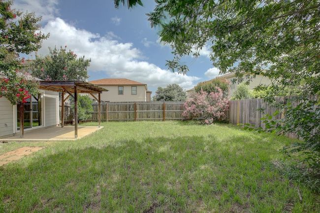 View of yard featuring a pergola and a patio | Image 10
