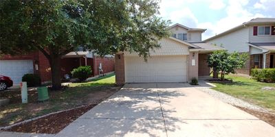 Two car garage and off street driveway parking for two additional cars. | Image 2