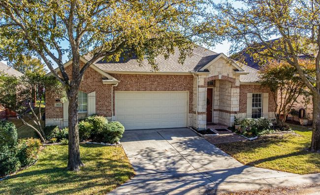 View of front of house featuring a garage and a front lawn | Image 39