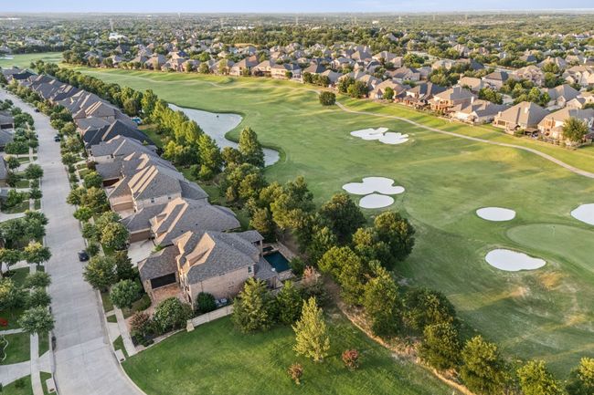 Aerial overview of property's location featuring nearby suburban area, a golf course, and a nearby body of​​‌​​​​‌​​‌‌​‌‌​​​‌‌​​‌‌​‌​​​​​‌ water | Image 25