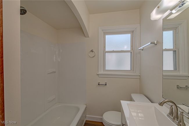 Full bathroom with wood-type flooring, vanity, toilet, and plenty of natural light | Image 8