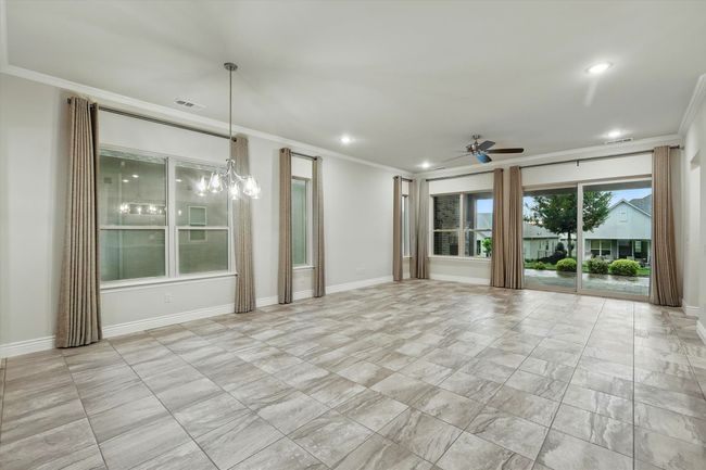 Living Room with crown molding, a ceiling fan, recessed lighting | Image 10