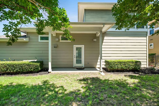 Rear view of house featuring fence, a patio area, and a lawn | Image 30