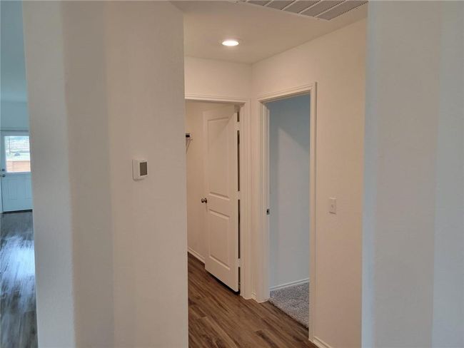 Hallway with dark wood-style flooring and recessed lighting | Image 30
