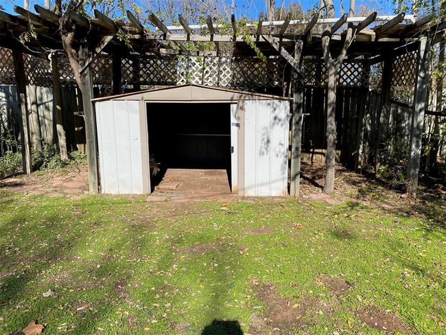 View of shed featuring a pergola | Image 7