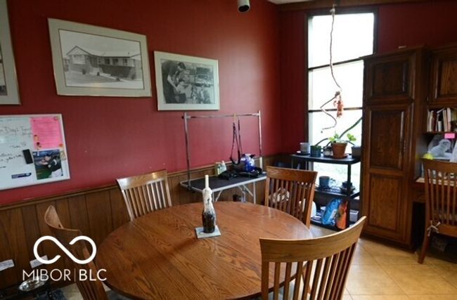 dining area featuring light tile patterned floors and a wealth of natural light | Image 12