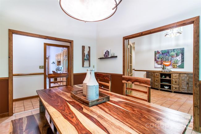 The dining room has French door leading to the foyer and pocket doors leading to the kitchen | Image 13