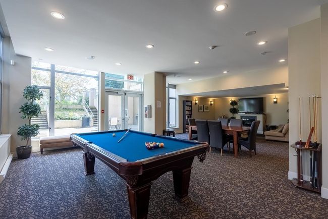 Playroom featuring carpet floors, recessed lighting, billiards, baseboards, and french doors | Image 10
