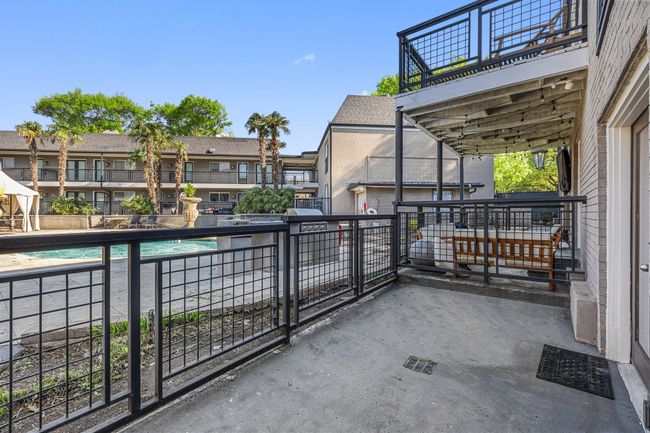 View of patio / terrace with area for grilling and a balcony | Image 24