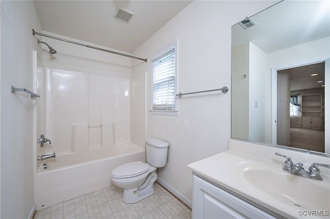 Full bath featuring vanity and tub / shower combination | Image 33