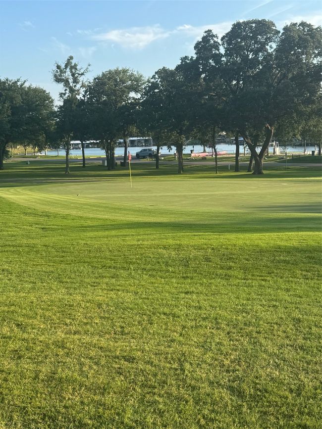 View of home's community with a lawn and view of golf course | Image 6