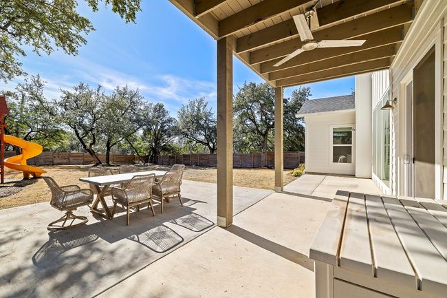 Downstairs back patio area looking into spacious back yard that is enclosed with privacy fence | Image 29
