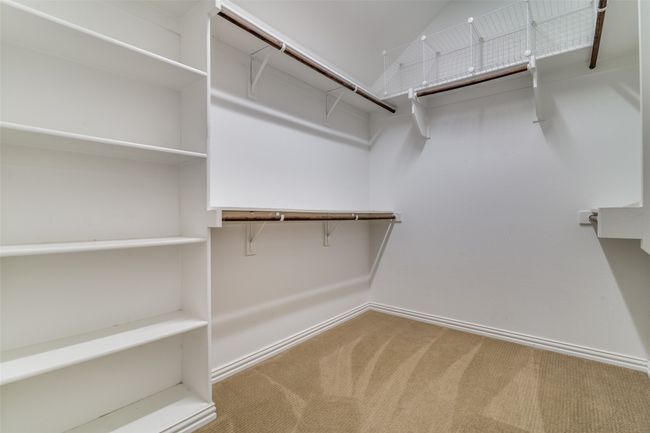 Walk in closet featuring carpet floors | Image 17