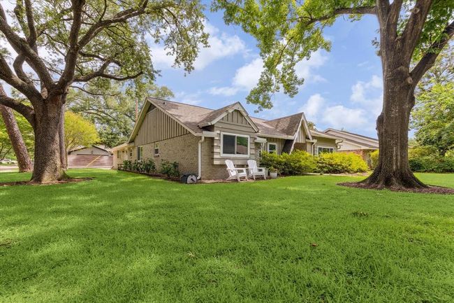 Prime corner lot with mature trees, a lush lawn, and an efficient sprinkler system. | Image 6