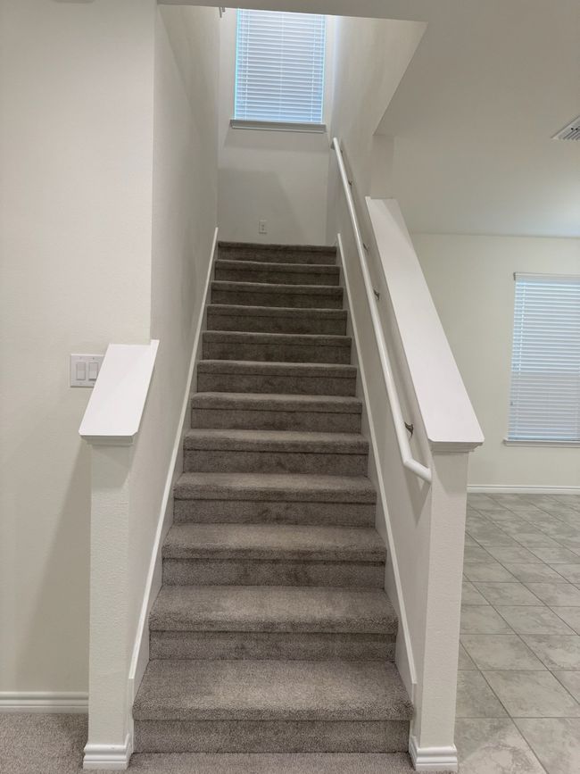 Staircase with baseboards and plenty of natural light | Image 16