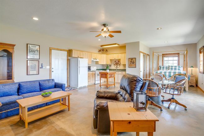 Living room featuring concrete flooring, recessed lighting, and ceiling fan | Image 28