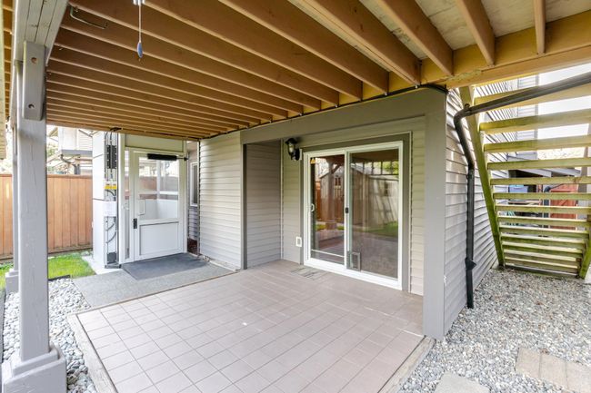 View of patio featuring fence, elevator on the side | Image 9