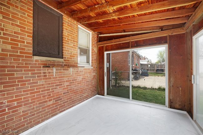 Unfurnished sunroom with beamed ceiling | Image 30