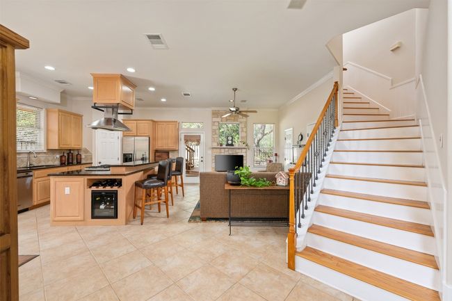 Upon entering you find an open-concept living space with timeless decor. | Image 4